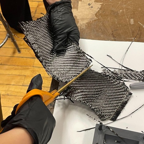 Cutting carbon fiber cloth for the steering linkages