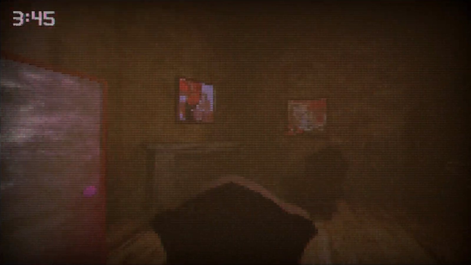 In-game view of the bedroom with framed pictures and the bed in the foreground